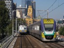 An up Traralgon service departs Flinders St as a silver awaits platform space during the afternoon peak. Jan. 6 2011
