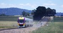 To celebrate the reopening of Clunes station a special was run, here it is seen returning to Ballarat approaching the highway level crossing a few Kilometres south of
Clunes near the site of the former Tourello loop. Dec. 3 2011